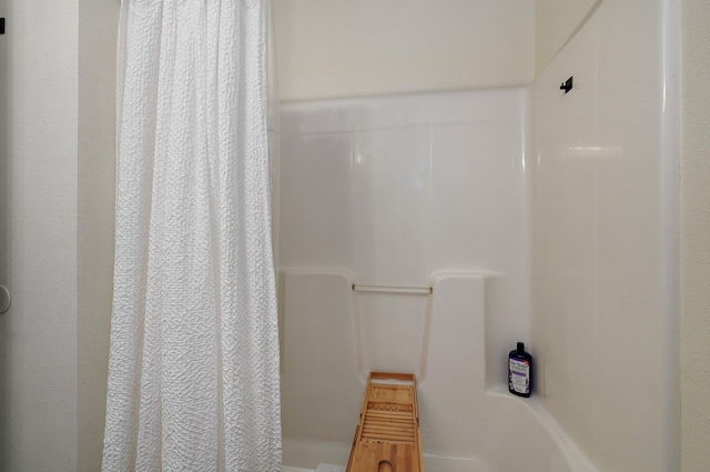 bathroom with a shower with curtain