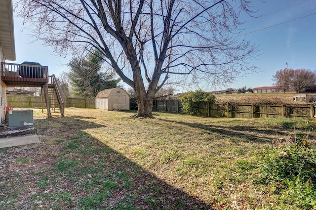 view of yard featuring central AC unit and a deck