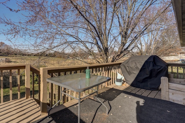 wooden deck featuring area for grilling