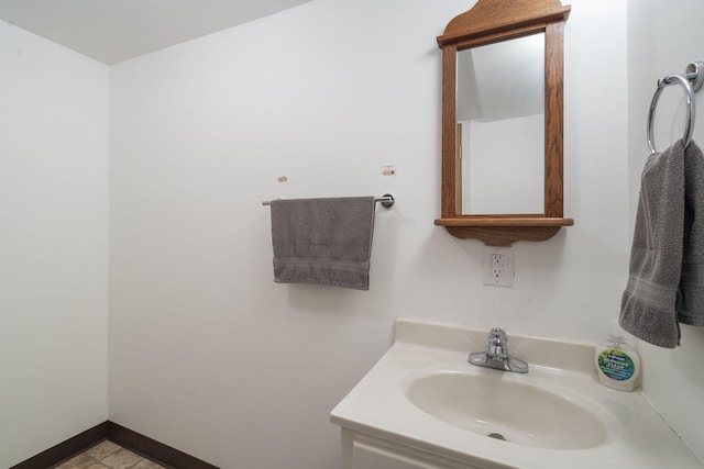 bathroom featuring tile patterned flooring and vanity