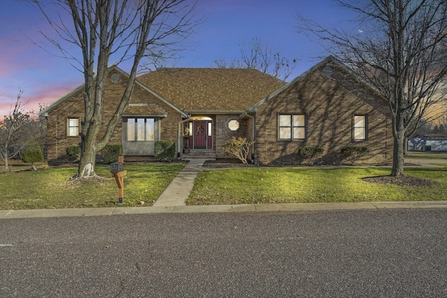 view of front of house with a yard