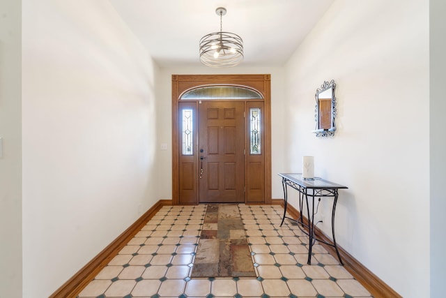 foyer entrance featuring a chandelier