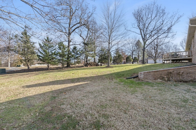 view of yard with a deck