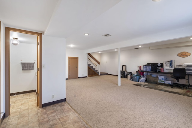 basement featuring light carpet