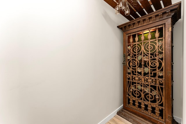 interior details featuring baseboards and wood finished floors