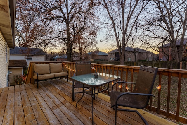 wooden terrace featuring fence