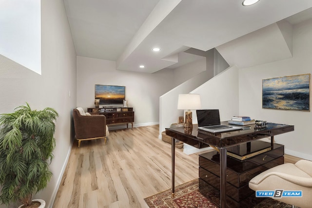 office featuring recessed lighting, light wood-type flooring, and baseboards