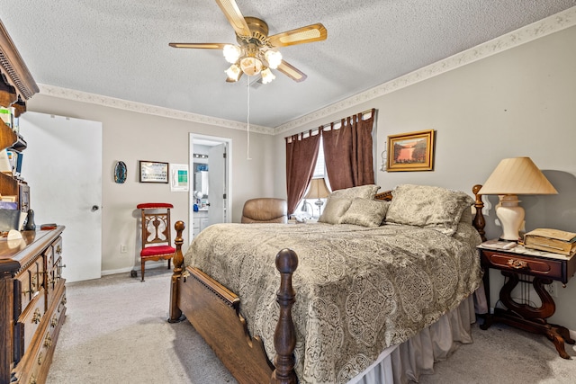 bedroom featuring ceiling fan, light colored carpet, and a textured ceiling