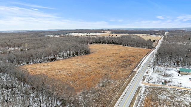 snowy aerial view featuring a rural view