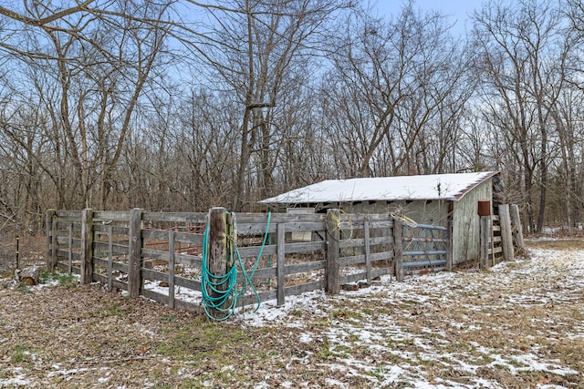 snowy yard with an outdoor structure