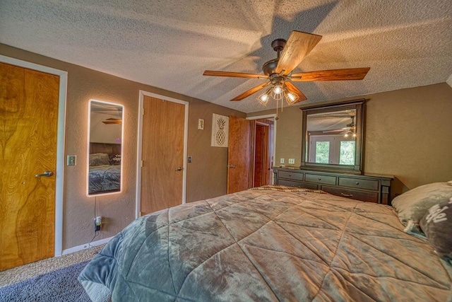 bedroom with carpet flooring, ceiling fan, and a textured ceiling