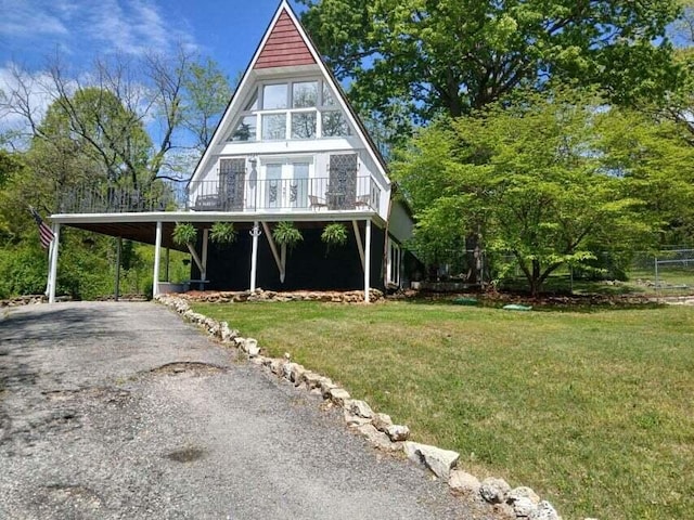 view of front facade with a carport and a front yard