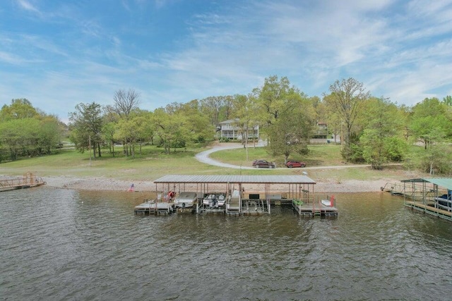 dock area with a yard and a water view