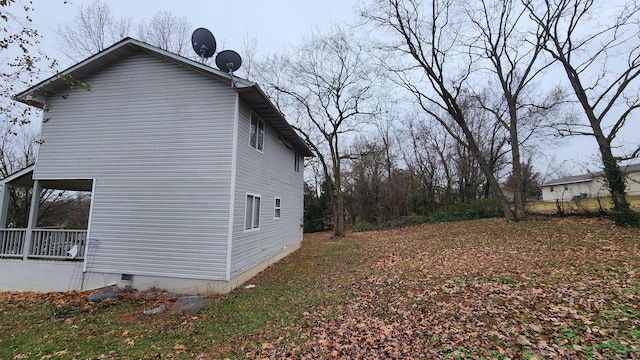 view of property exterior featuring covered porch