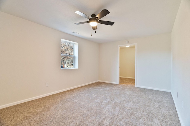 carpeted empty room with ceiling fan