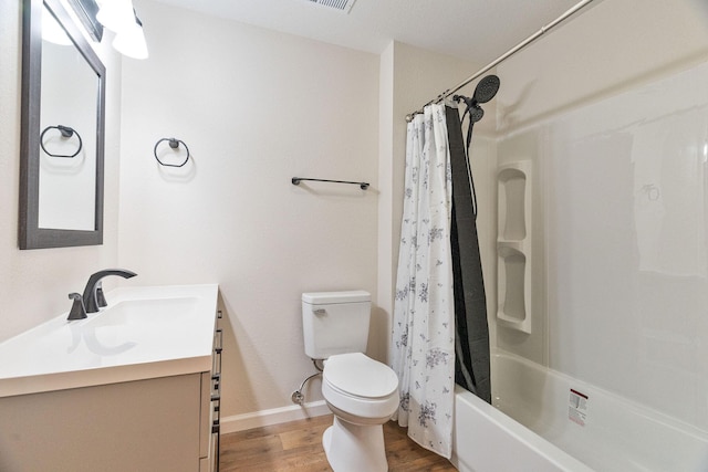 full bathroom featuring wood-type flooring, vanity, toilet, and shower / bath combo with shower curtain