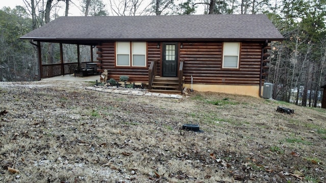 log home featuring central air condition unit