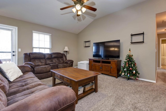 living room with light carpet, ceiling fan, and vaulted ceiling