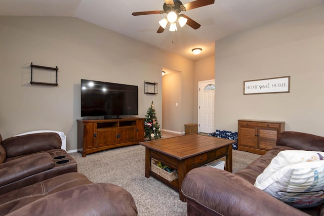 living room featuring light colored carpet, vaulted ceiling, and ceiling fan