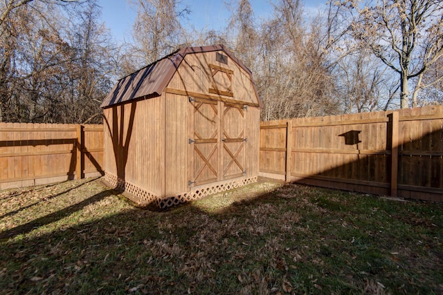 view of outbuilding featuring a yard