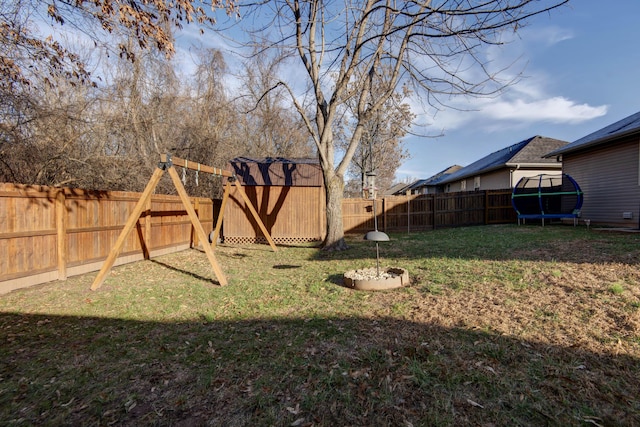 view of yard featuring a trampoline