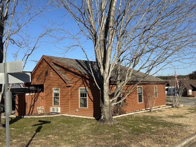 rear view of property with a yard