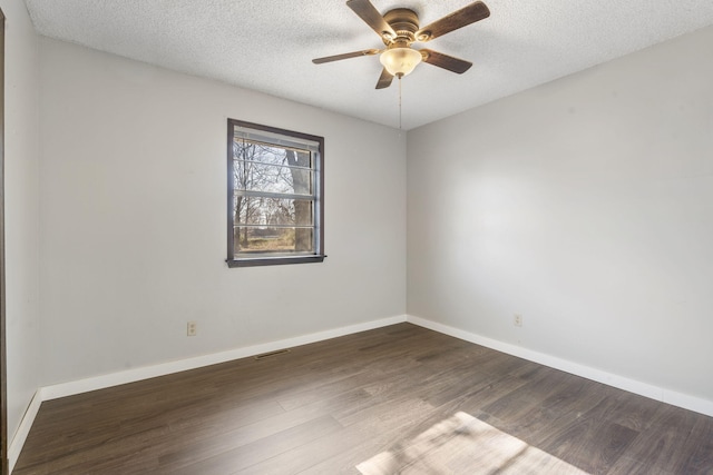 spare room with hardwood / wood-style floors, ceiling fan, and a textured ceiling