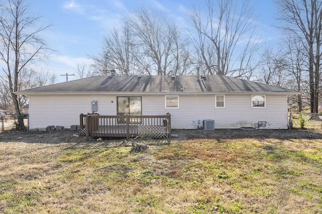 back of house featuring central air condition unit, a yard, and a deck