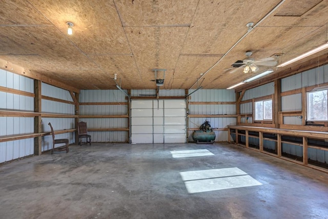 garage featuring ceiling fan and a garage door opener