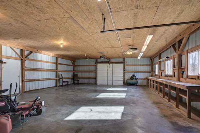 garage featuring a garage door opener and ceiling fan