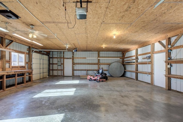 garage with a garage door opener and ceiling fan