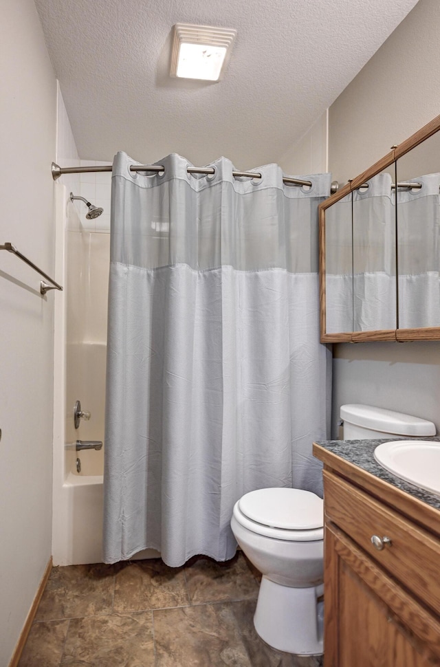 full bathroom with shower / tub combo with curtain, vanity, a textured ceiling, and toilet