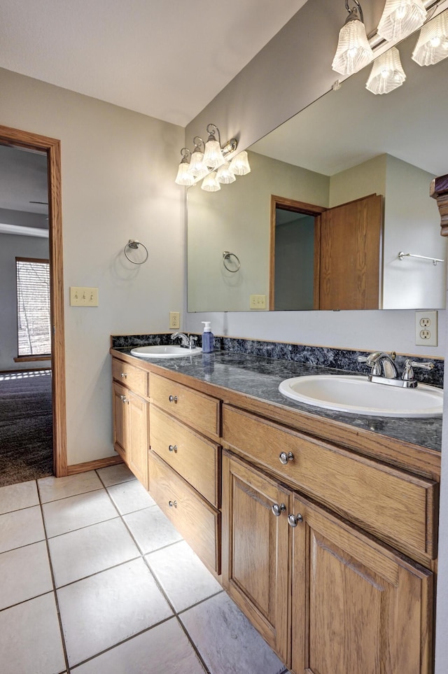 bathroom with tile patterned flooring and vanity