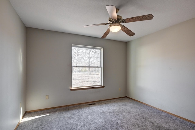 carpeted empty room with ceiling fan