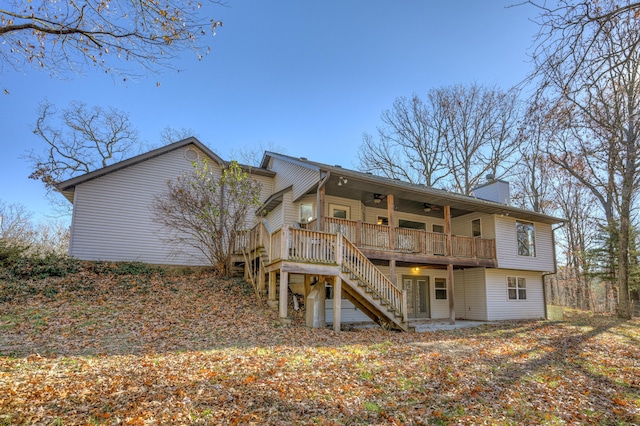 rear view of house with ceiling fan and a deck