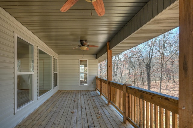 wooden deck featuring ceiling fan