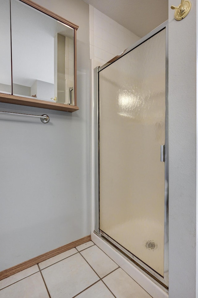 bathroom featuring tile patterned floors and walk in shower