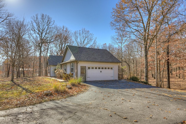 view of side of home with a garage