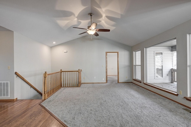 spare room featuring ceiling fan, wood-type flooring, and lofted ceiling