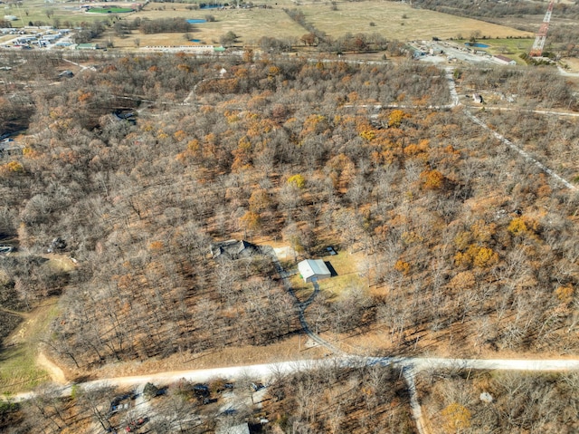 birds eye view of property with a rural view