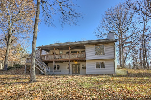 rear view of house featuring a wooden deck, ceiling fan, and french doors