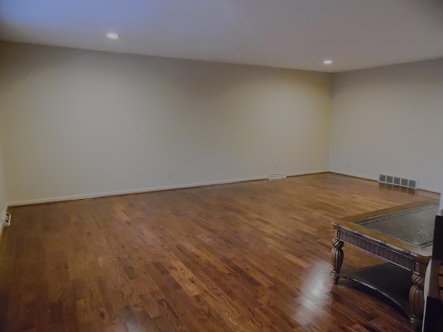 unfurnished room featuring dark hardwood / wood-style floors