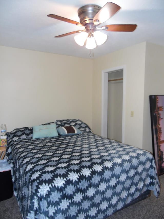 carpeted bedroom with ceiling fan