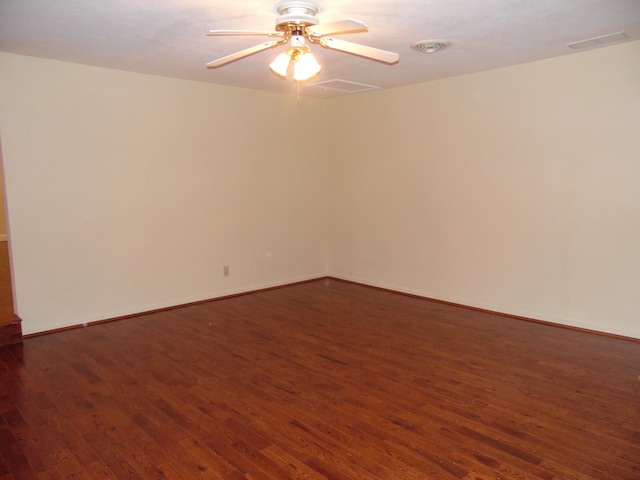 unfurnished room featuring dark wood-type flooring