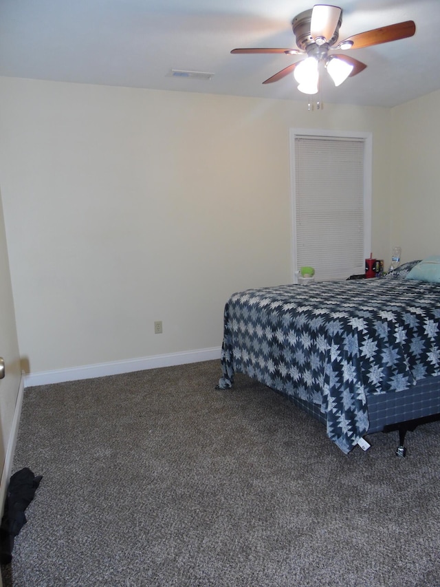 bedroom with ceiling fan and carpet floors