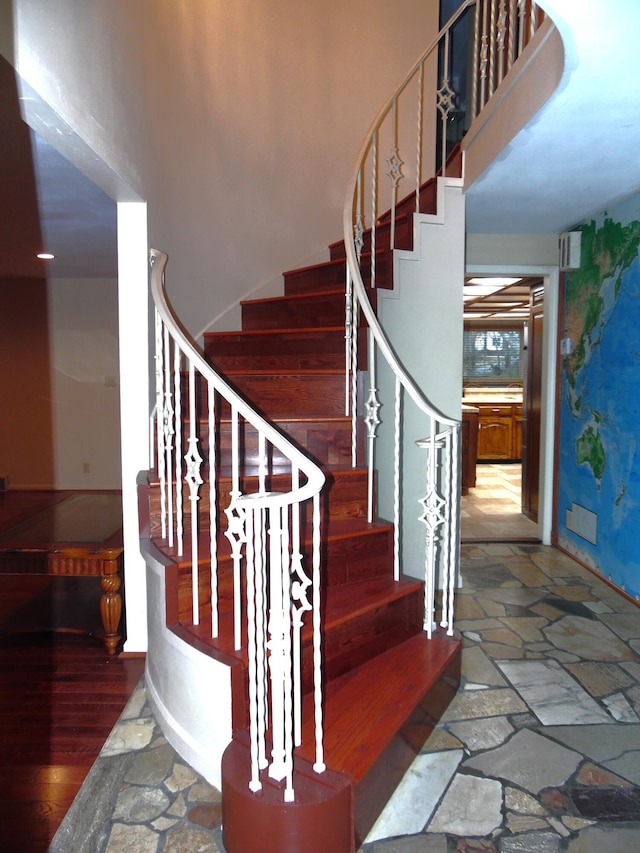 stairs with hardwood / wood-style flooring