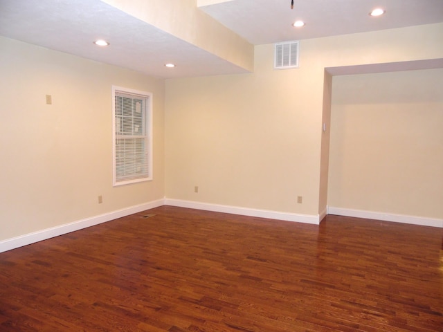 basement featuring dark hardwood / wood-style floors