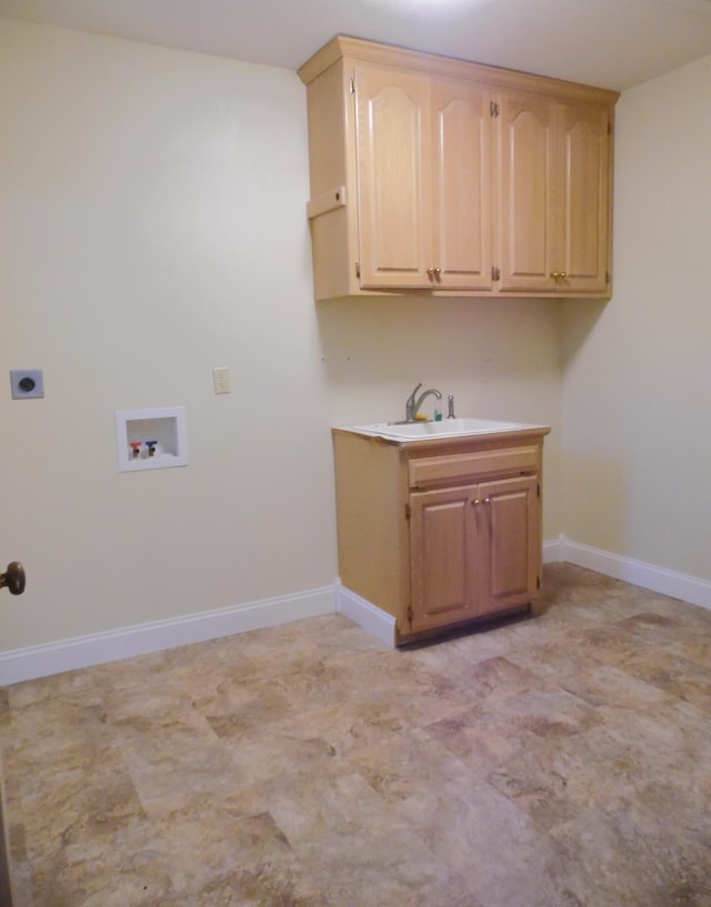 washroom featuring hookup for an electric dryer, cabinets, sink, and washer hookup