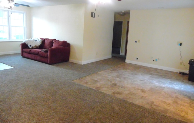 carpeted living room featuring ceiling fan