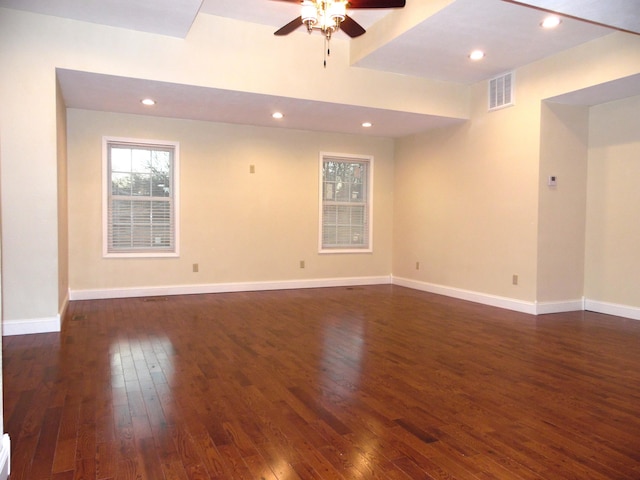 unfurnished room with ceiling fan and dark hardwood / wood-style flooring